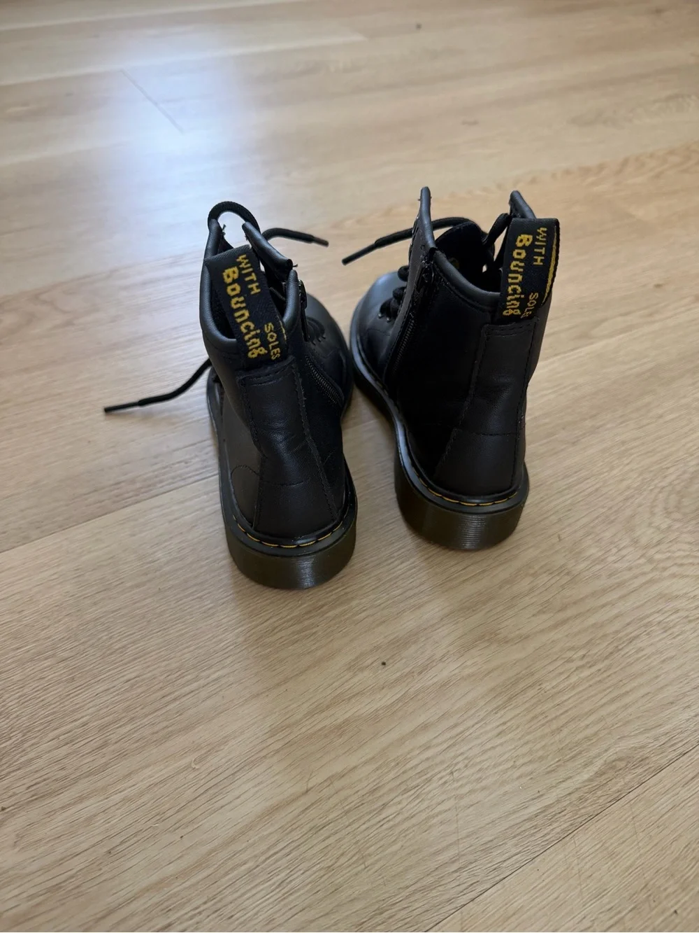 Dr. Martens Kids Black Leather Ankle Boots with Yellow Stitching